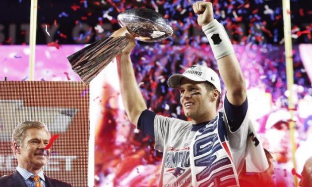 Quarterback Tom Brady made Super Bowl history as the New England Patriots toppled the defending champion Seattle Seahawks in Arizona to claim their fourth title