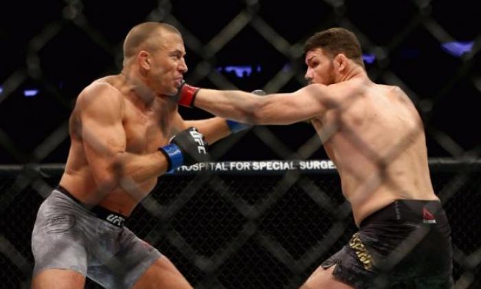 Georges St-Pierre ended a four-year exile from UFC in style to claim the middleweight title with an impressive victory over Britain's Michael Bisping