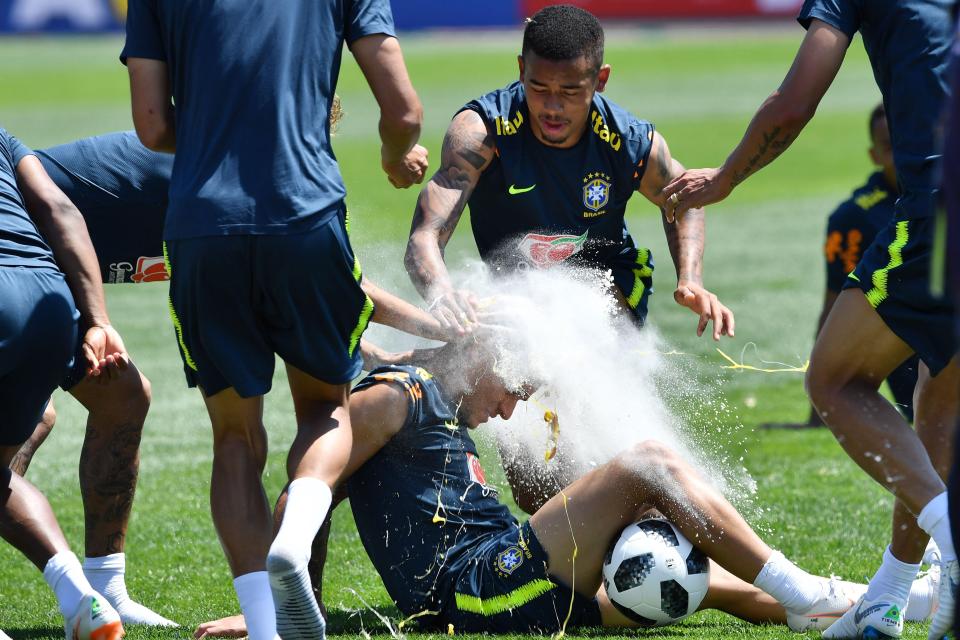  The Brazil players pelt Coutinho with eggs