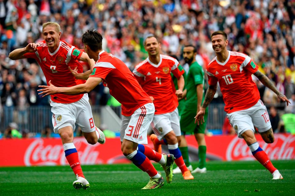  Yury Gazinsky celebrates scoring the opener for Russia