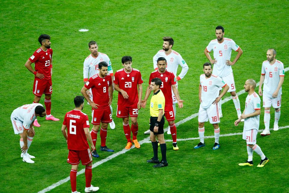  The players await the decision of the referee after the full time whistle