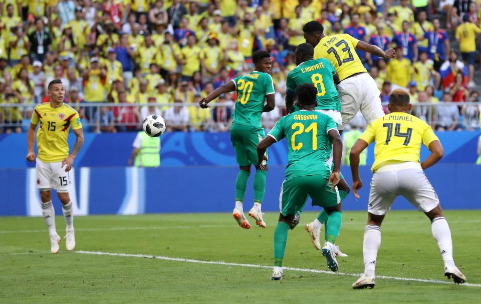  Yerry Mina's header saw Colombia top Group H