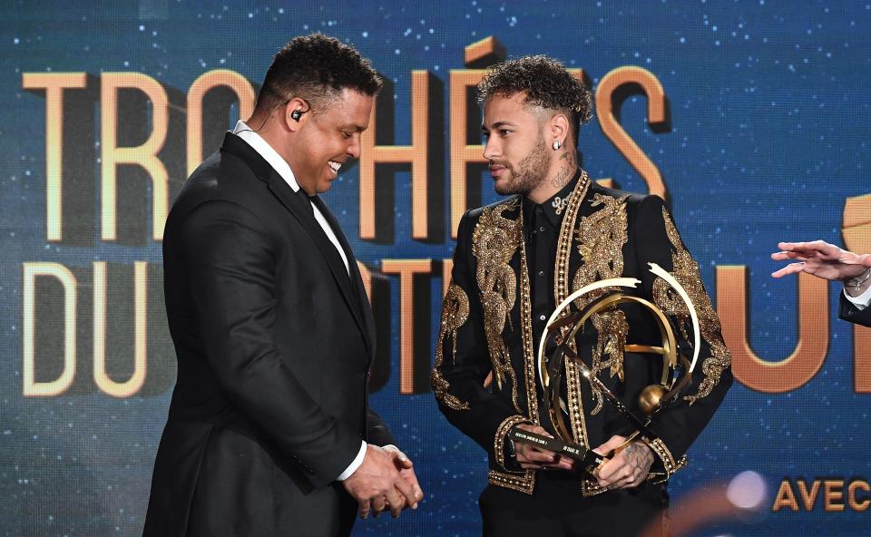  Neymar is handed the Ligue 1 Best Player award by Brazil legend Ronaldo