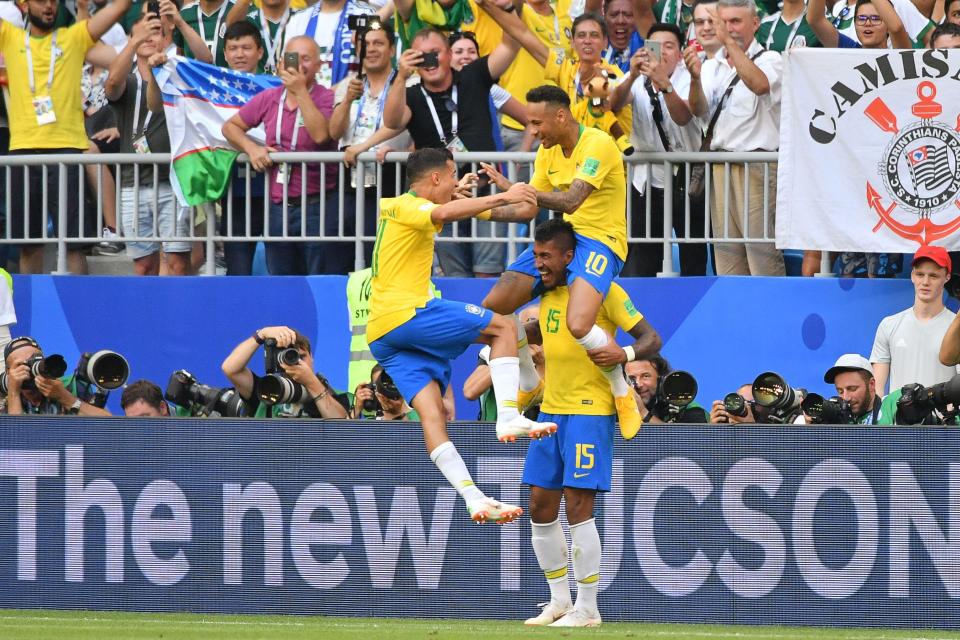  Paulinho lifted Neymar aloft after the opening goal