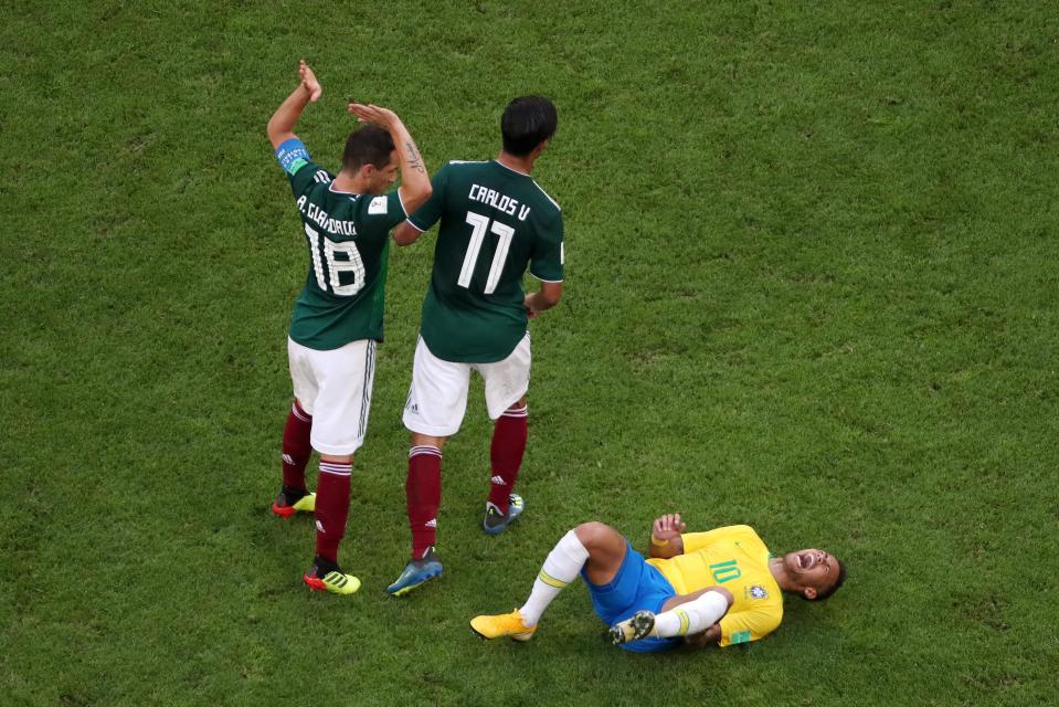  Neymar hits the deck during Brazil's victory over Mexico