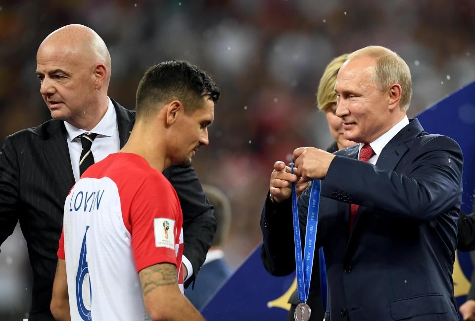  Dejan Lovren receives his World Cup runners up medal from Russian president Vladimir Putin