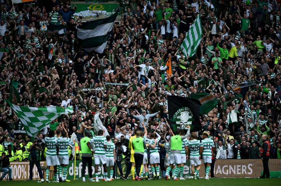  Celtic players salute the Celtic Park faithful after a game