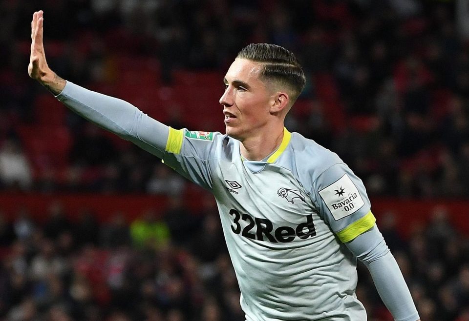  Wilson scored a brilliant free-kick at Old Trafford to draw Derby level and then raised his hand in celebration as he darted off to enjoy the moment with his team-mates