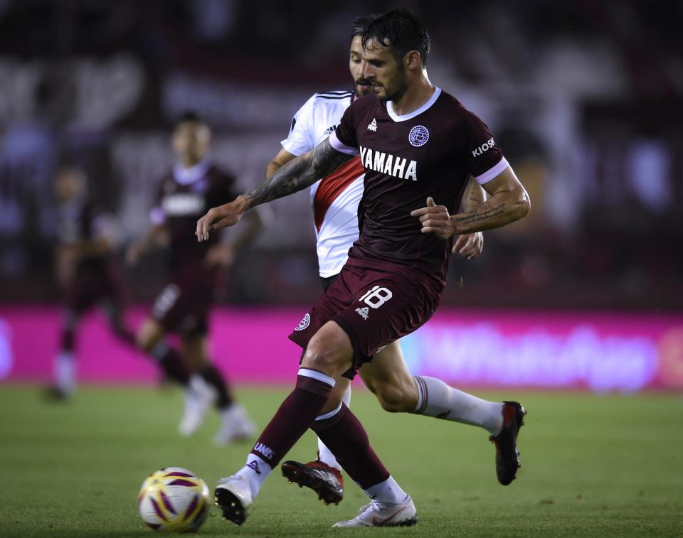  The Lanus star in action against River Plate.