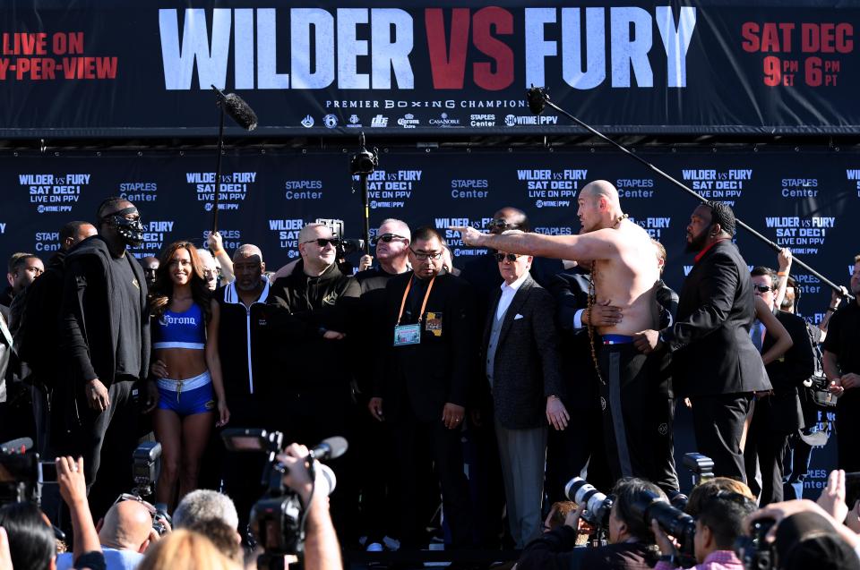  Fury and Wilder had to be held apart at the weigh in