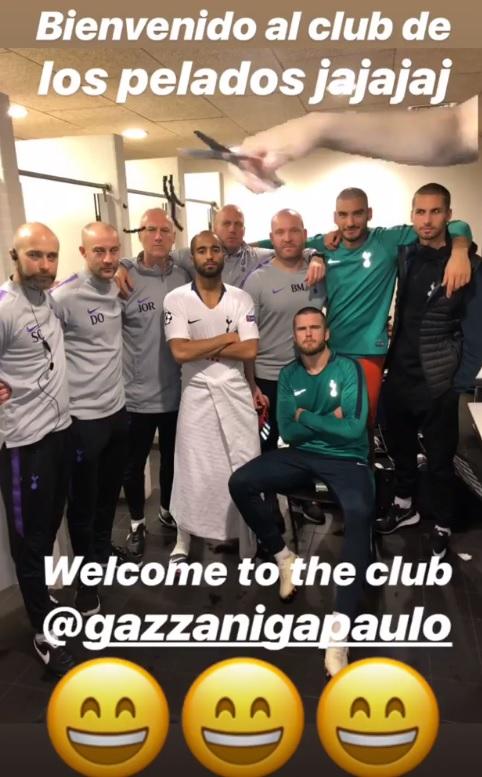  Gazzaniga posed with Lucas Moura and Eric Dier and other members of staff