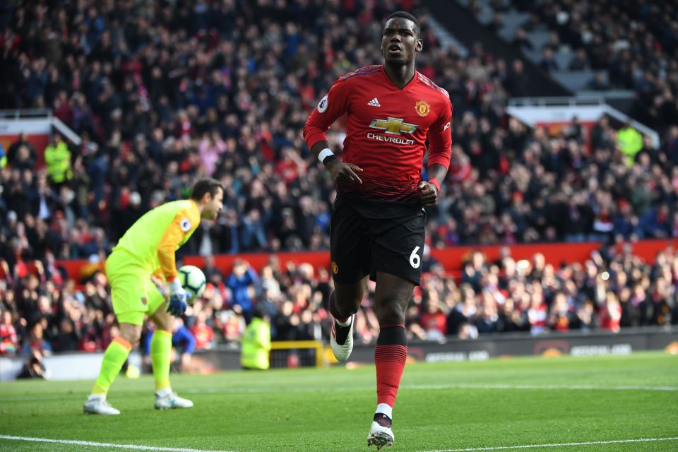  The midfielder celebrates opening the scoring at Old Trafford