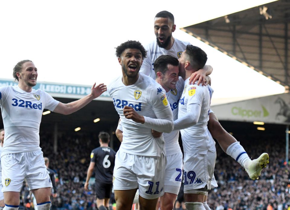  Harrison's team-mates congratulate him following his goal