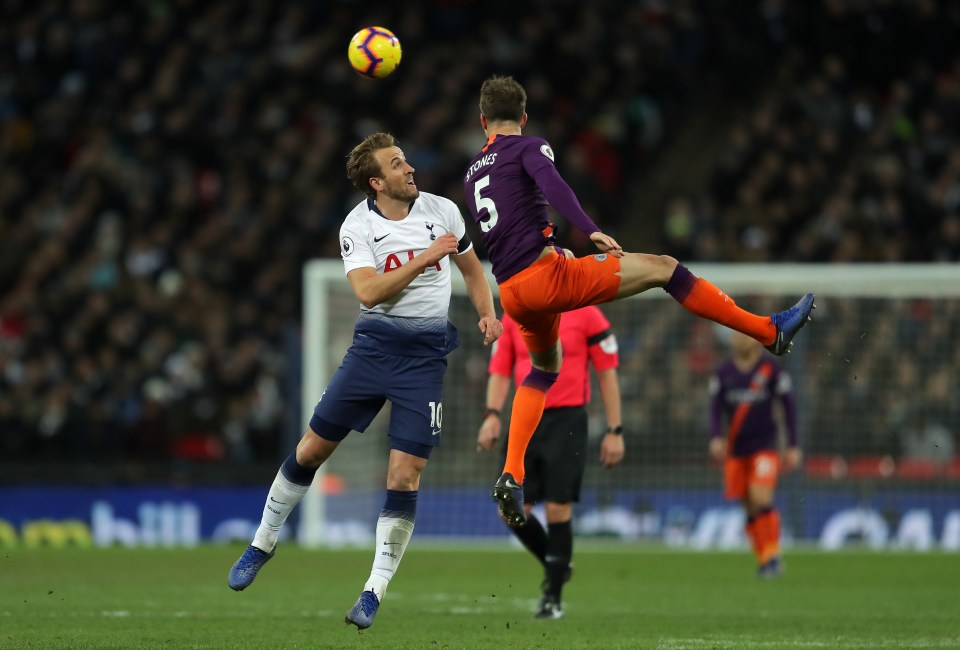  Tottenham Hotspur star Harry Kane challenges Man City ace John Stones.