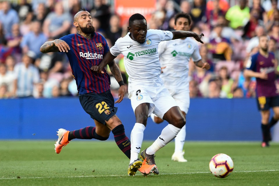  Djene Dakonam ends a Barcelona attack