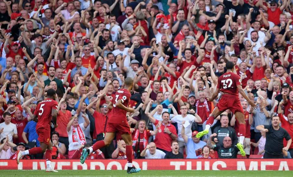  Joel Matip, number 32 (right) celebrating in-front of the Liverpool fans are scoring the opening goal against Arsenal at Anfield