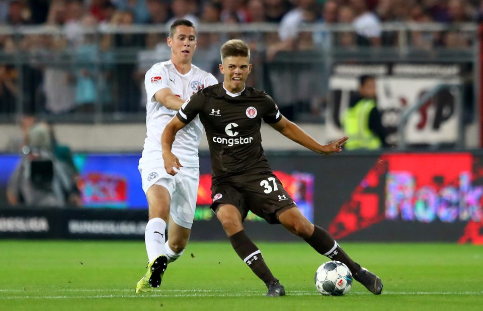  St Pauli star Finn Ole Becker holds off a challenge