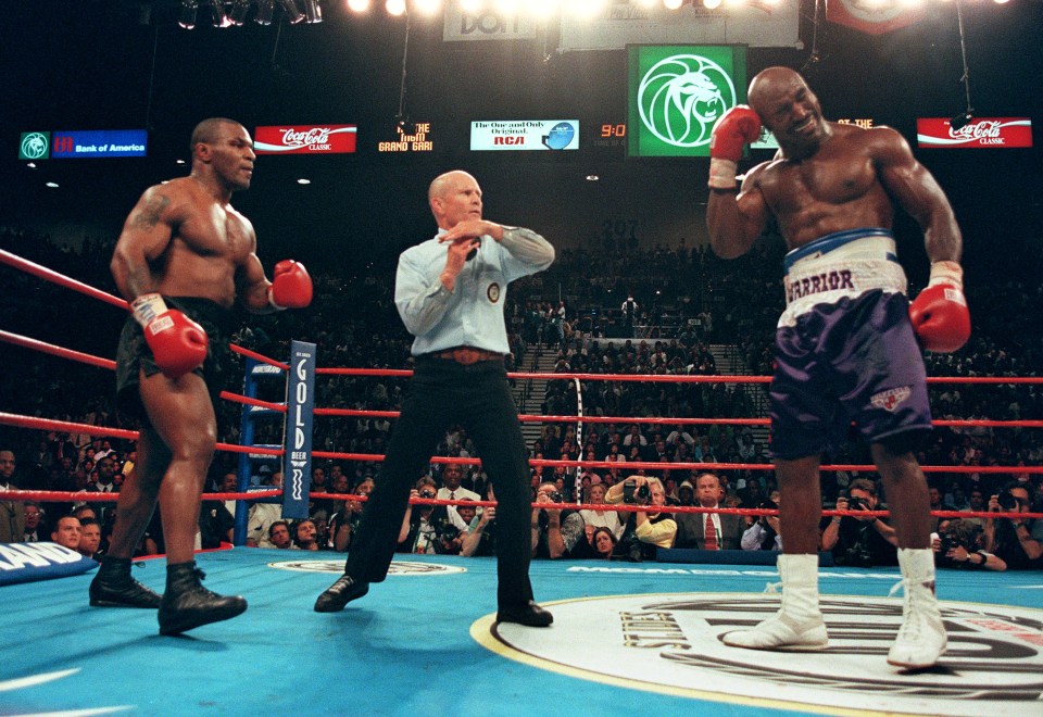  Holyfield points out Tyson chewed off part of his ear
