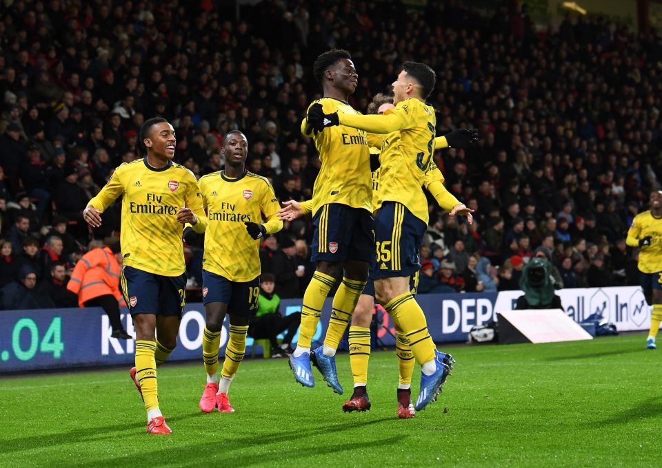  Martinelli celebrates with Bukayo Saka after setting up his team-mate for Arsenal's opener