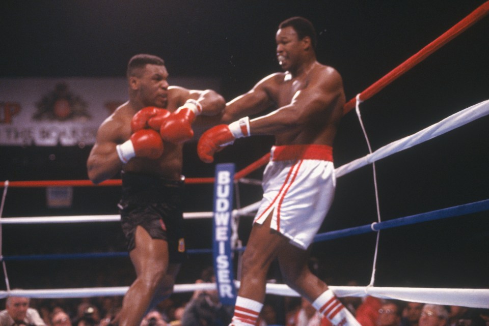  Mike Tyson punches Larry Holmes in 1988 just months before chatting with Jimmy Greaves