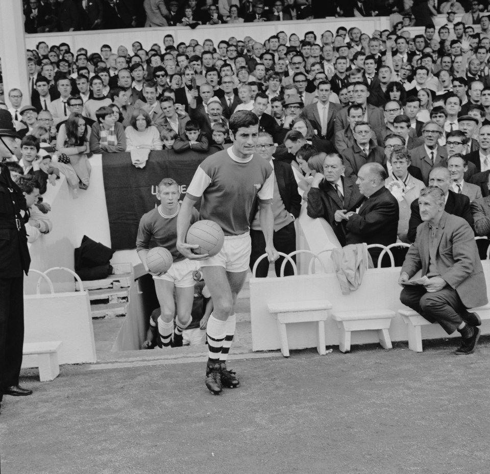  Frank McLintock walks out at White Hart Lane for another clash between the rivals