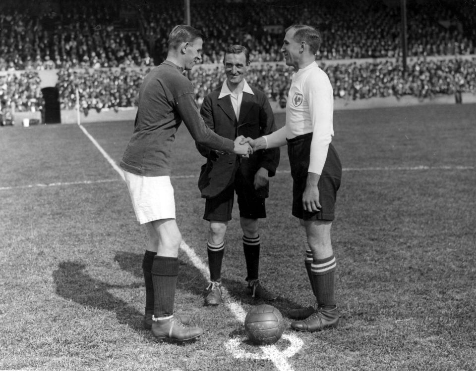  On August 29, 1925, Arsenal captain Charles Buchan and Tottenham Hotspur skipper Arthur Grimsdell, shake hands