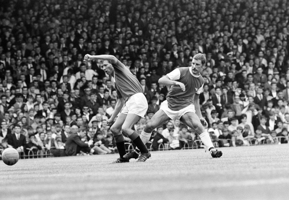  Terry Neill battles with Alex Ferguson of Glasgow Rangers in a pre-season friendly match at Highbury