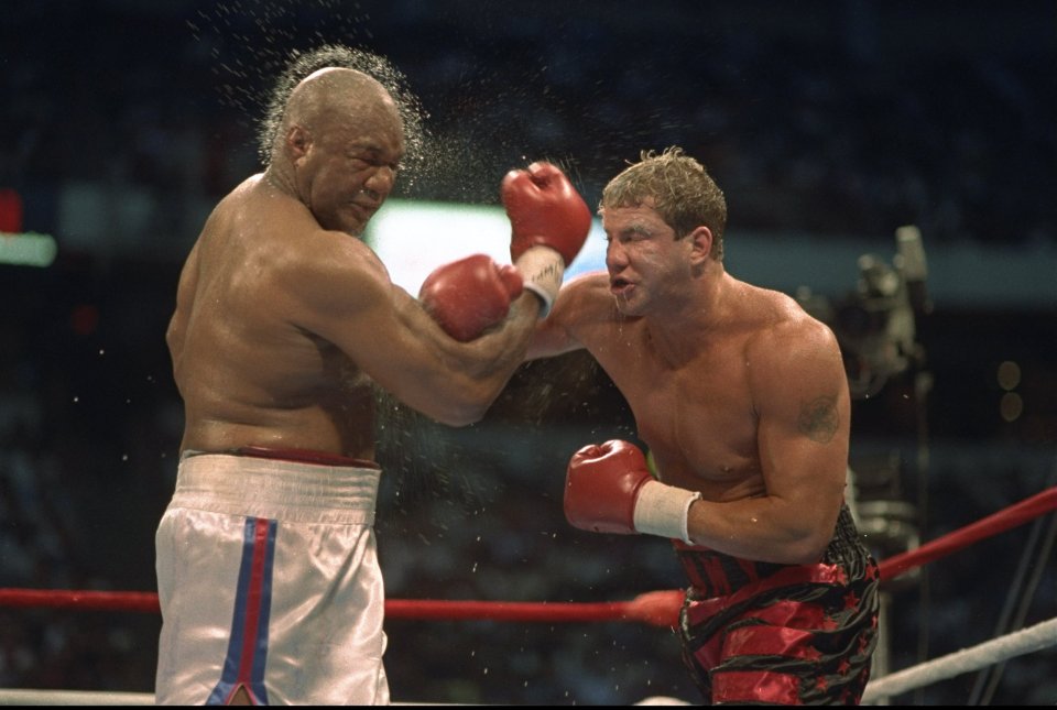  Morrison lands a clubbing right on Foreman's chin during their fight