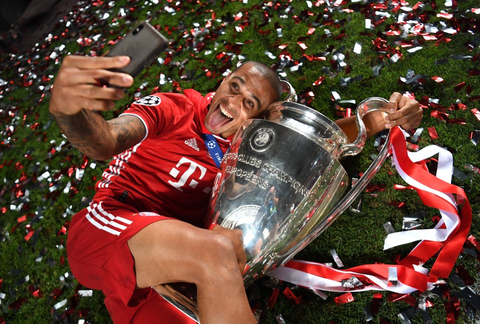  Thiago already has the look of a Liverpool player, dressed all in red and holding the European Cup