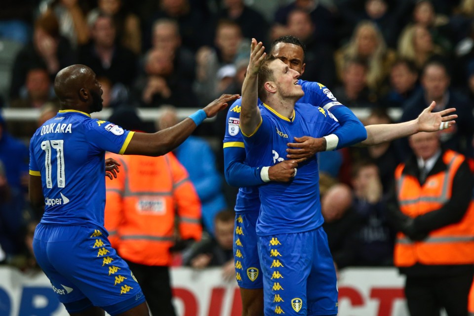  Chris Wood scored a stoppage-time equaliser to earn play-off chasing Leeds a point at second-placed Newcastle