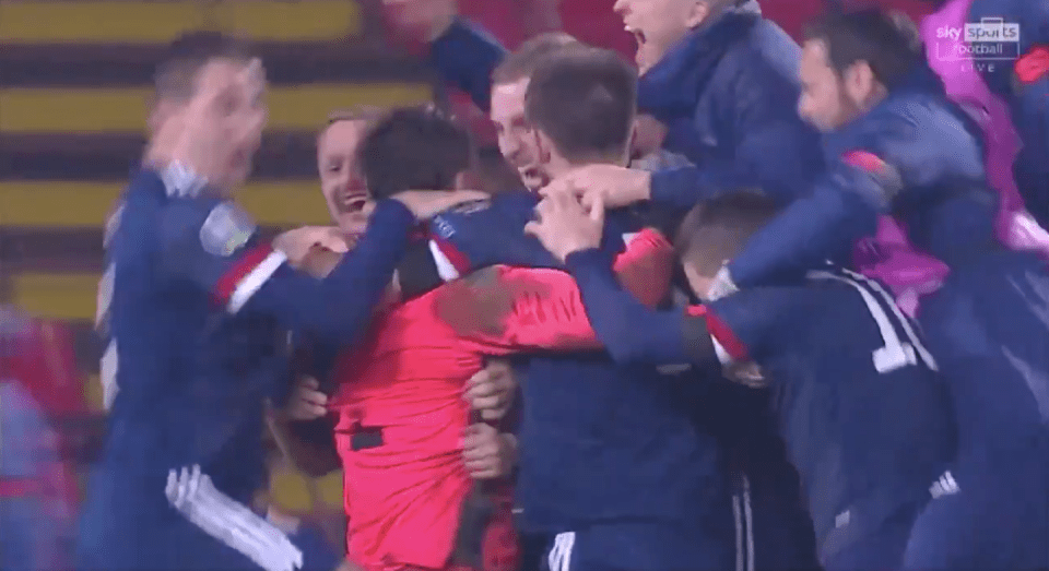  Marshall was rushed by his Scotland teammates