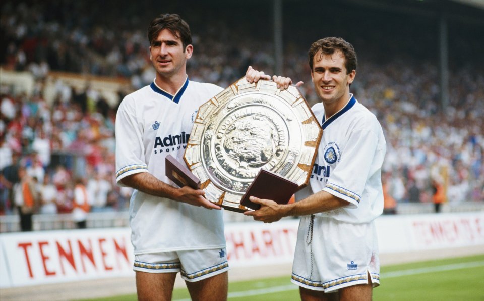 Eric Cantona celebrates winning the Charity Shield with Leeds