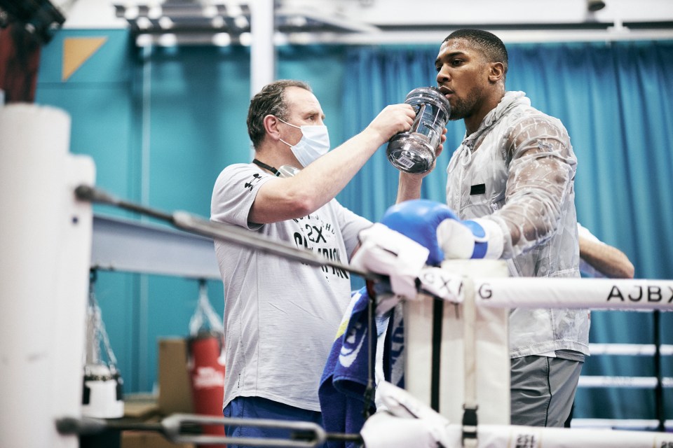 Rob McCracken is AJ's trainer