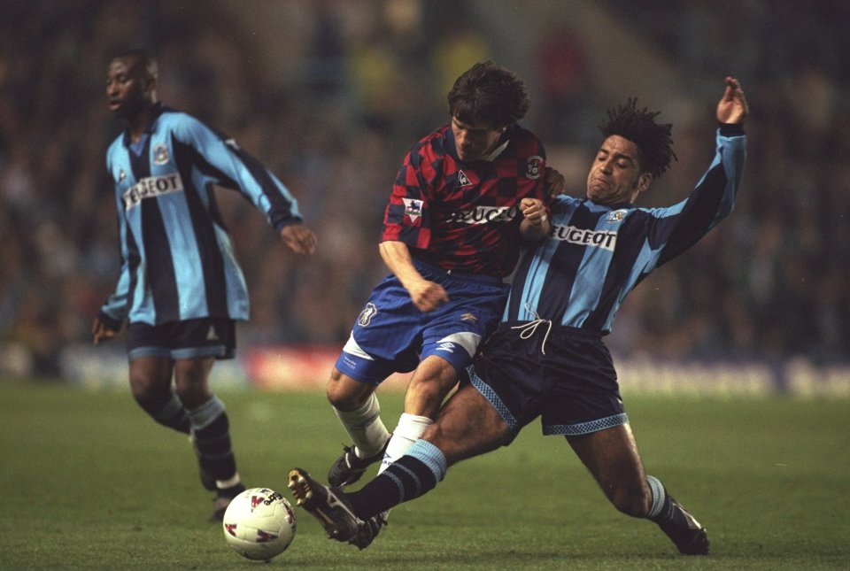Chelsea legend Gianfranco Zola sporting one bizarre make-shift number