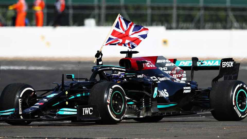 Hamilton raised the Union Flag from his car after securing victory