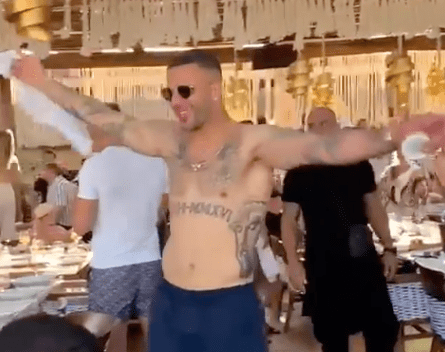 Walker was leading the rendition of Sweet Caroline on holiday