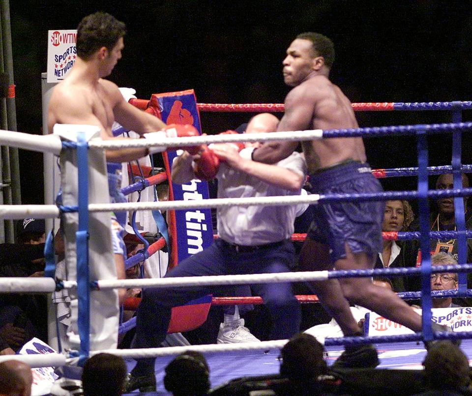 The fight was over as soon as it began but Tyson was like a man possessed and the referee got caught in the crossfire after calling a halt to it