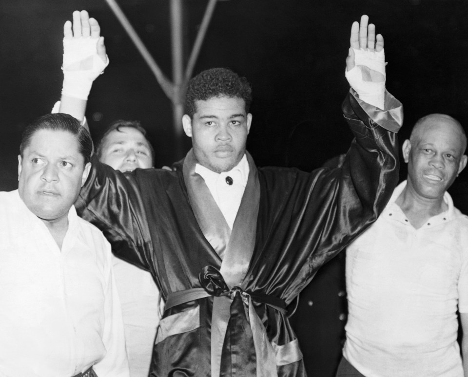 Louis, right, knocked out 23 opponents in 27 title fights, including five world champions