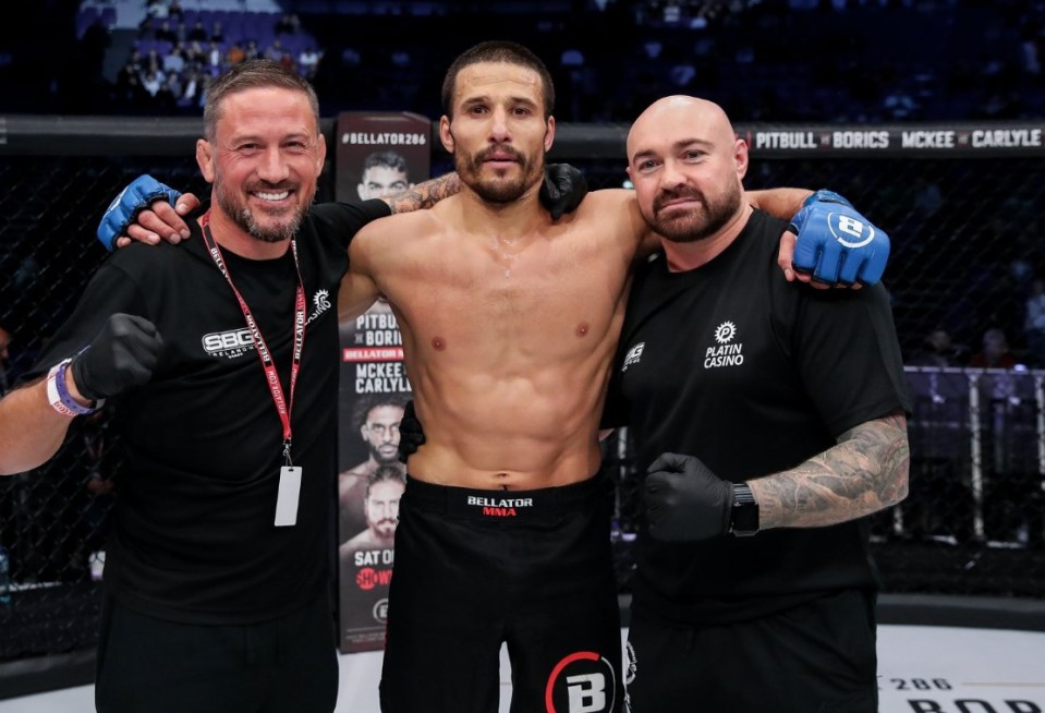 Poclit celebrated with world-renowned MMA coach, John Kavanagh