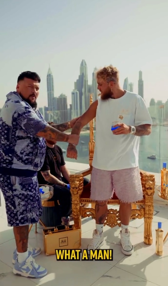 He sipped the blue raspberry drink as he was inked in the sunshine
