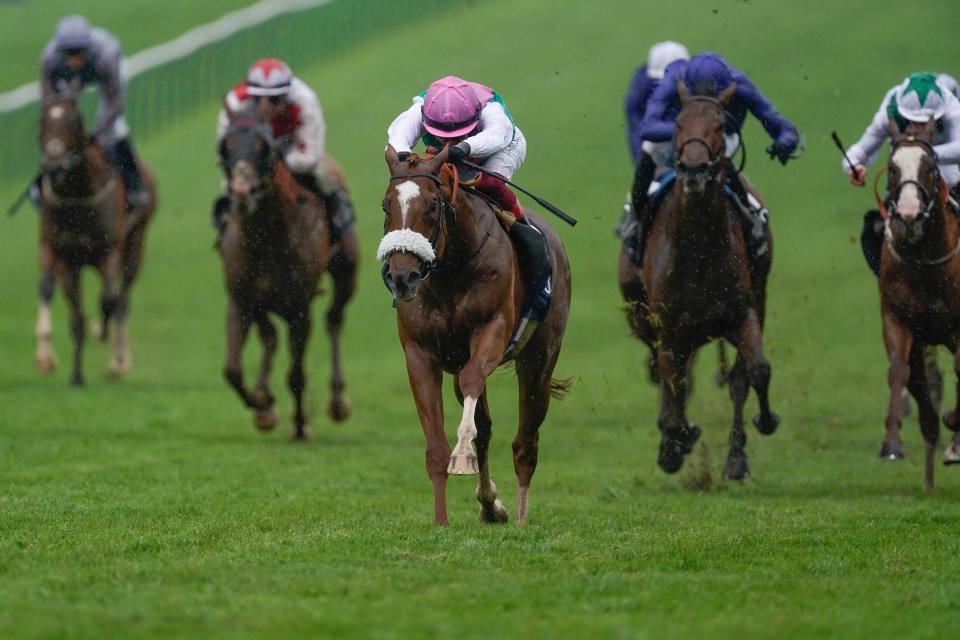 Frankie Dettori riding Chaldean (pink cap) win The Qipco 2000 Guineas Stakes at Newmarket Racecourse on May 06, 2023