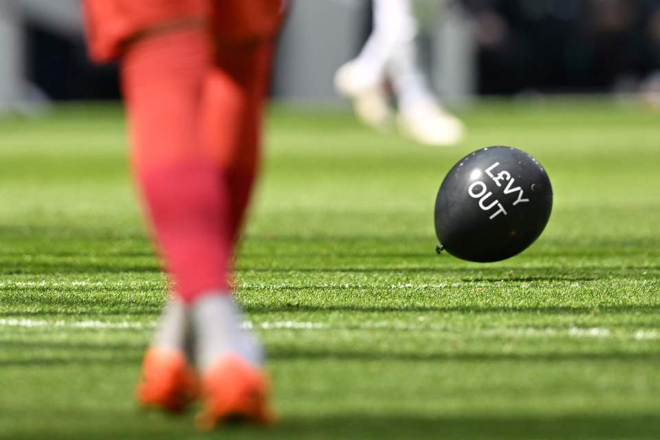 Balloons littered the pitch in the 22 minute - representing the length of Levy's tenure