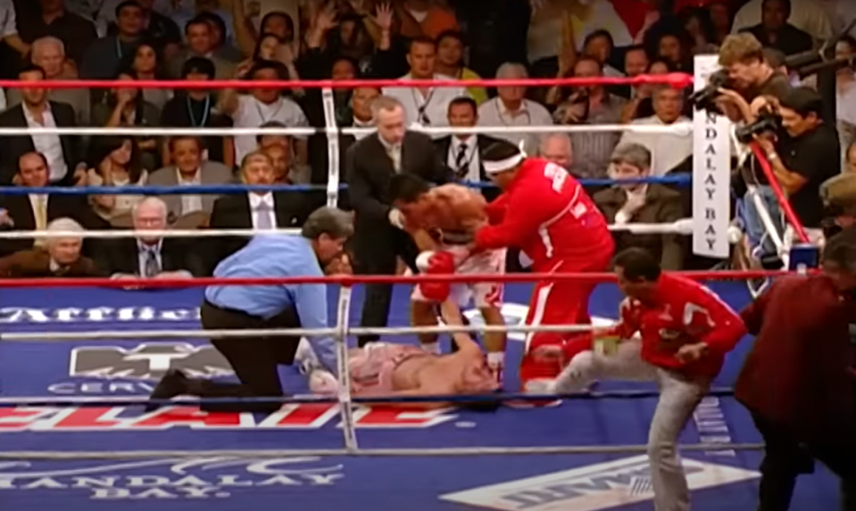 But instead of immediately celebrating, Pacquiao tried to help his opponent