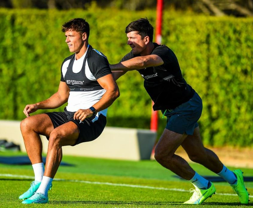 Maguire jostling on the training pitch with McClelland, who appeared on the seventh series of Love Island