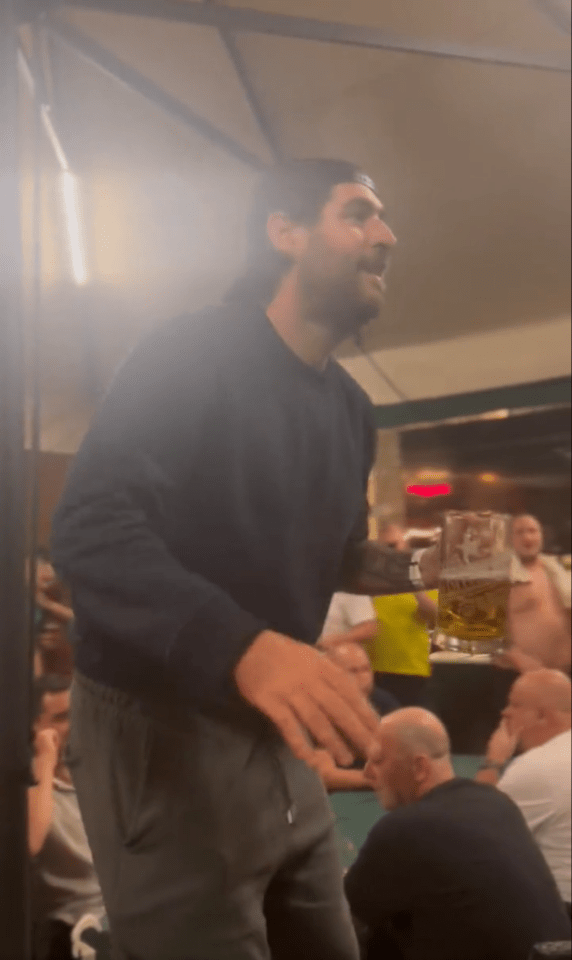 Graham could be seen having a great time as he drank beer and sung along with his fellow Newcastle fans