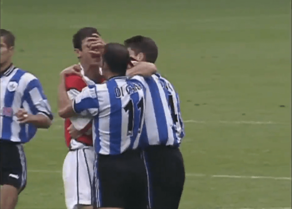 Di Canio then grabbed the face of the Arsenal legend