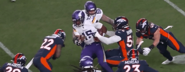Denver's Kareem Jackson, 22, prepares to stop Minnesota quarterback Josh Dobbs, 15