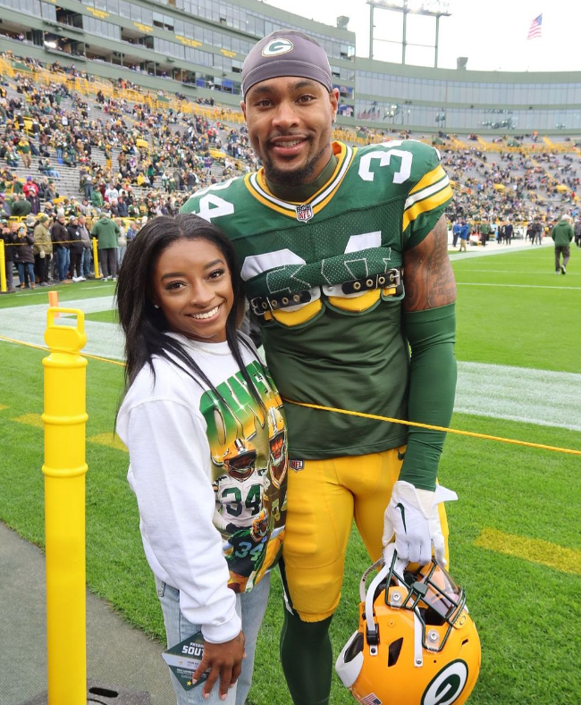 The US gymnastics star has been a regular at Lambeau Field this season