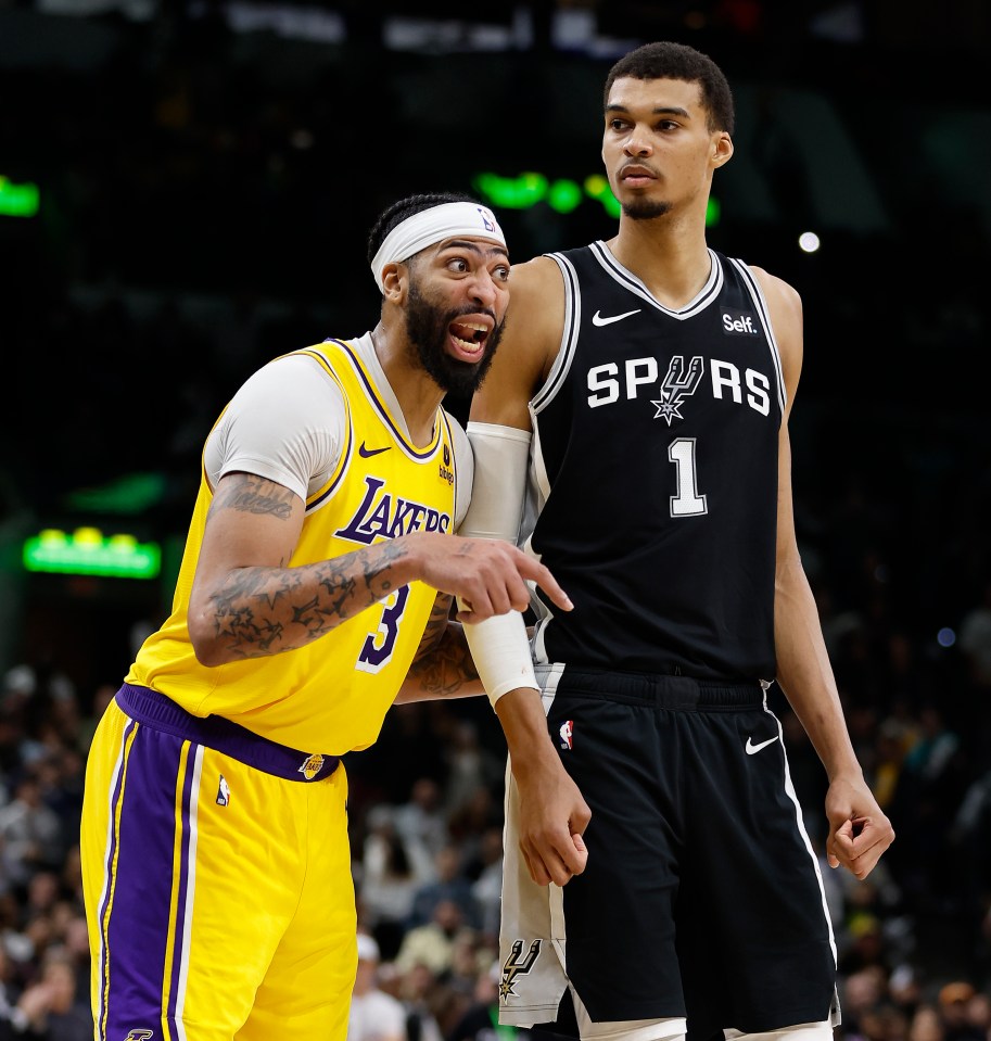 SAN ANTONIO, TX - DECEMBER 13: Anthony Davis #3 of the Los Angeles Lakers confers with teammates as he guards Victor Wembanyama #1 of the San Antonio Spurs in the second half at Frost Bank Center on December 13, 2023 in San Antonio, Texas. NOTE TO USER: User expressly acknowledges and agrees that, by downloading and or using this photograph, User is consenting to terms and conditions of the Getty Images License Agreement. (Photo by Ronald Cortes/Getty Images)