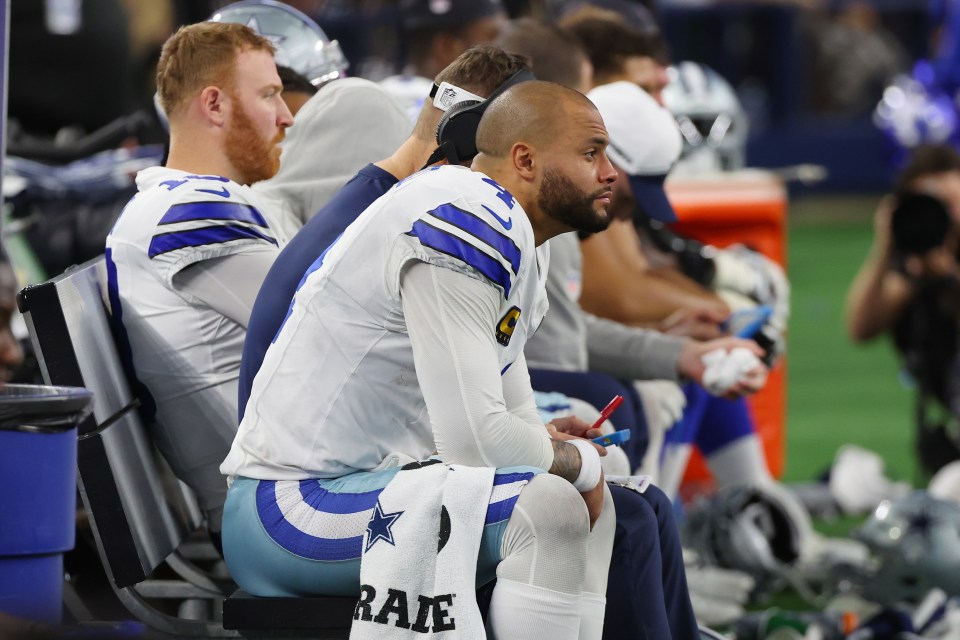 ARLINGTON, TEXAS - JANUARY 14: Dak Prescott #4 of the Dallas Cowboys sits on the bench during the fourth quarter of the NFC Wild Card Playoff game against the Green Bay Packers at AT&T Stadium on January 14, 2024 in Arlington, Texas. The Packers defeated the Cowboys 48-32. (Photo by Richard Rodriguez/Getty Images)